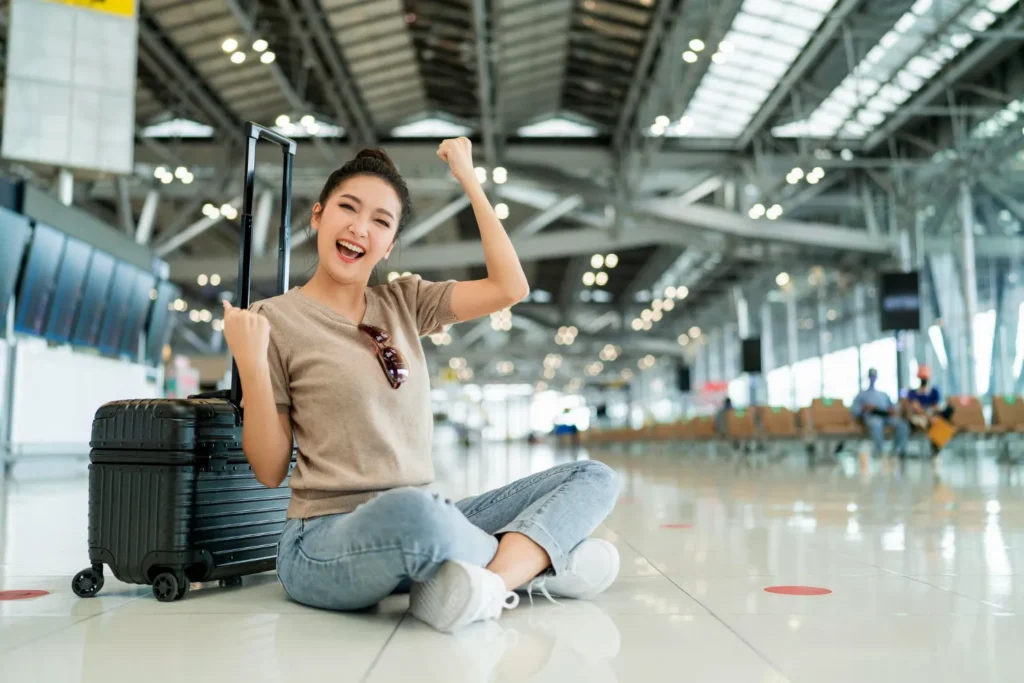 Traveller with luggage in an airport terminal