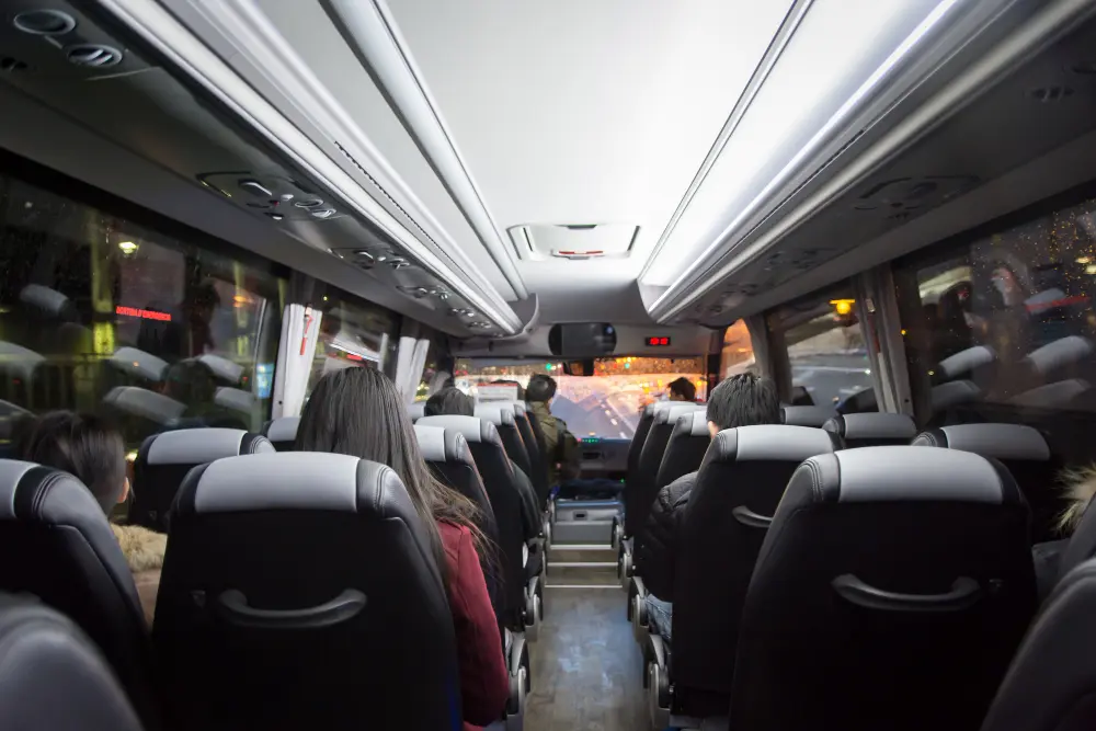 Passengers seated inside a 35 seater coach