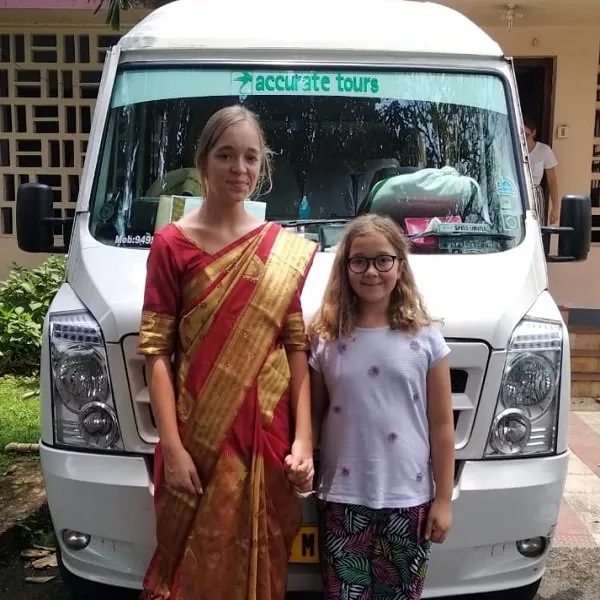 Overseas guests and their Tempo Traveller before a day of sightseeing