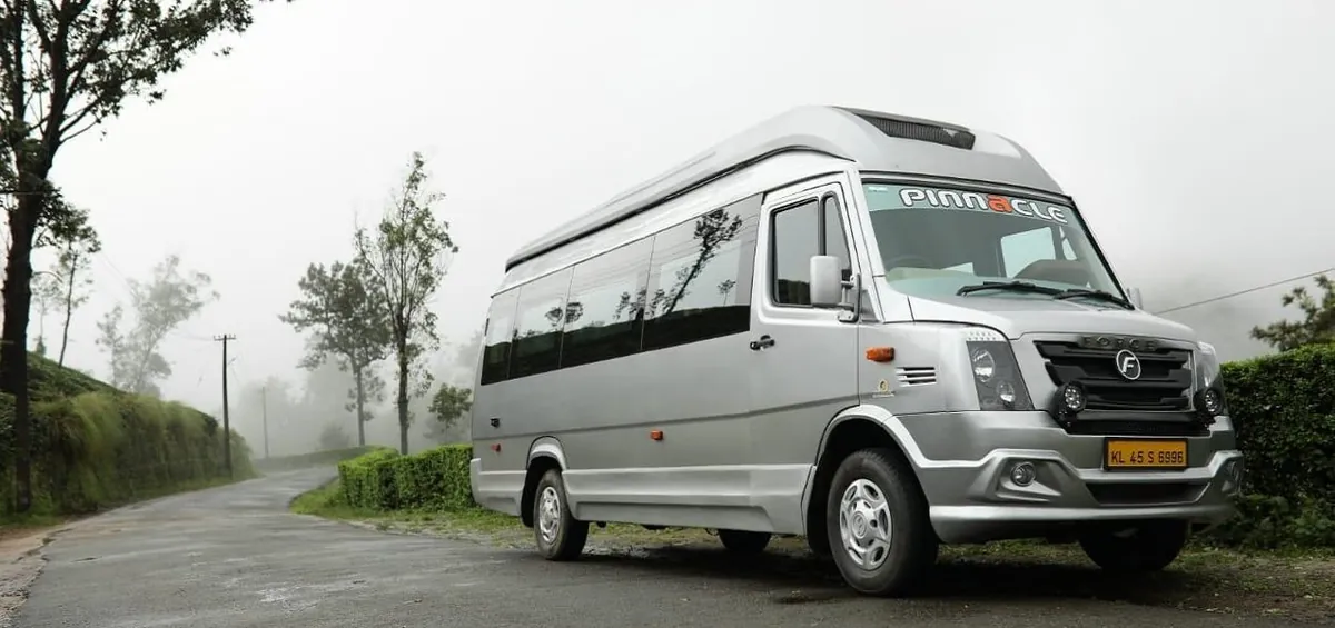 Tempo Traveller on a misty Western Ghats morning